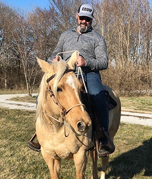 Mark S. Harris on horseback
